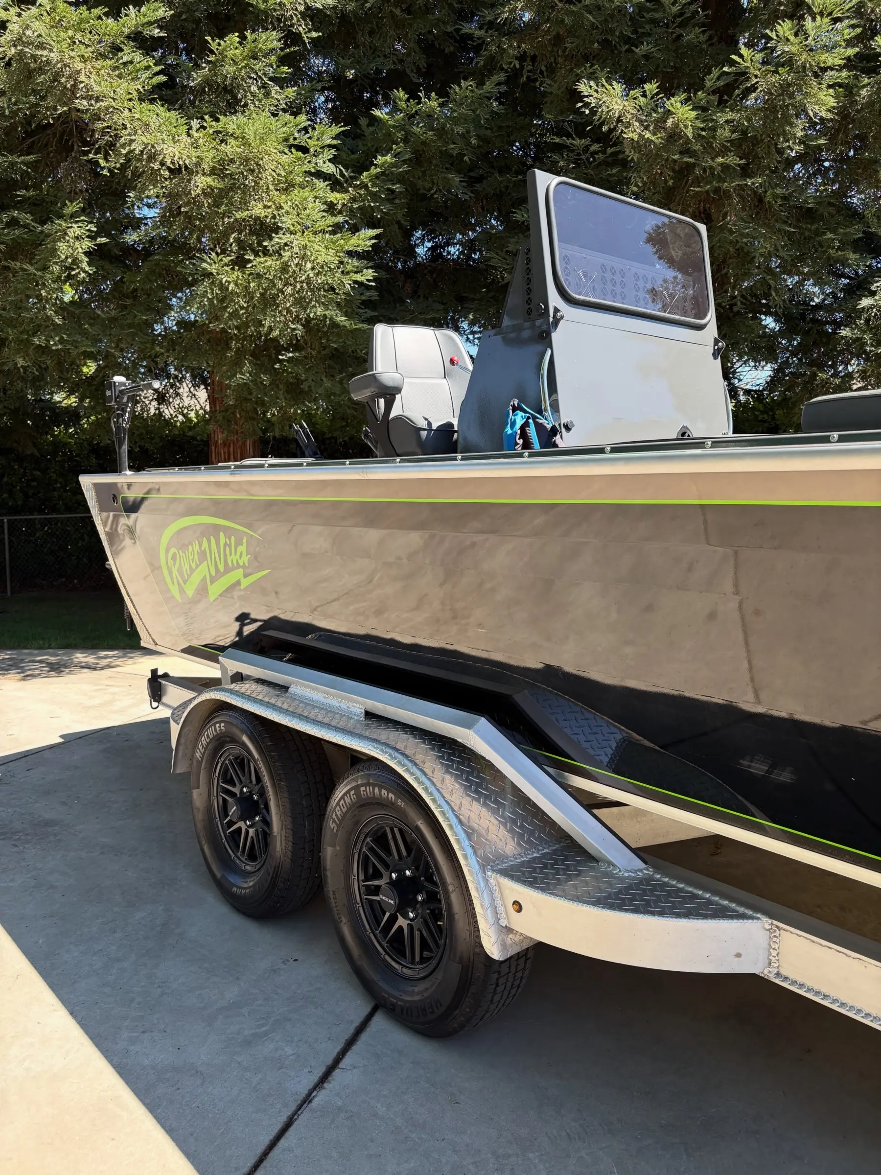 Aluminum bass boat on its trailer after a detail