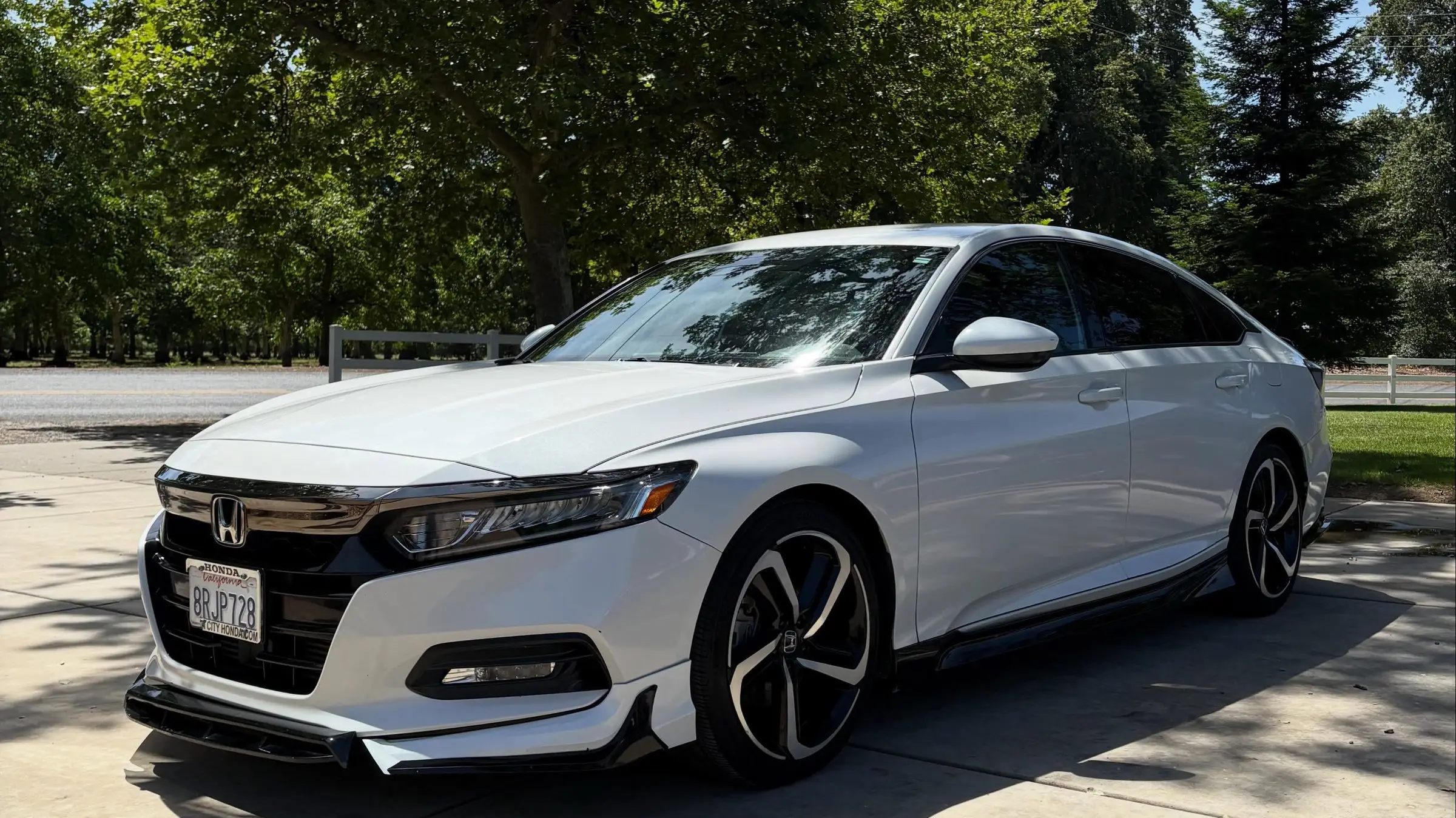 White Honda Accord in a driveway after a detail