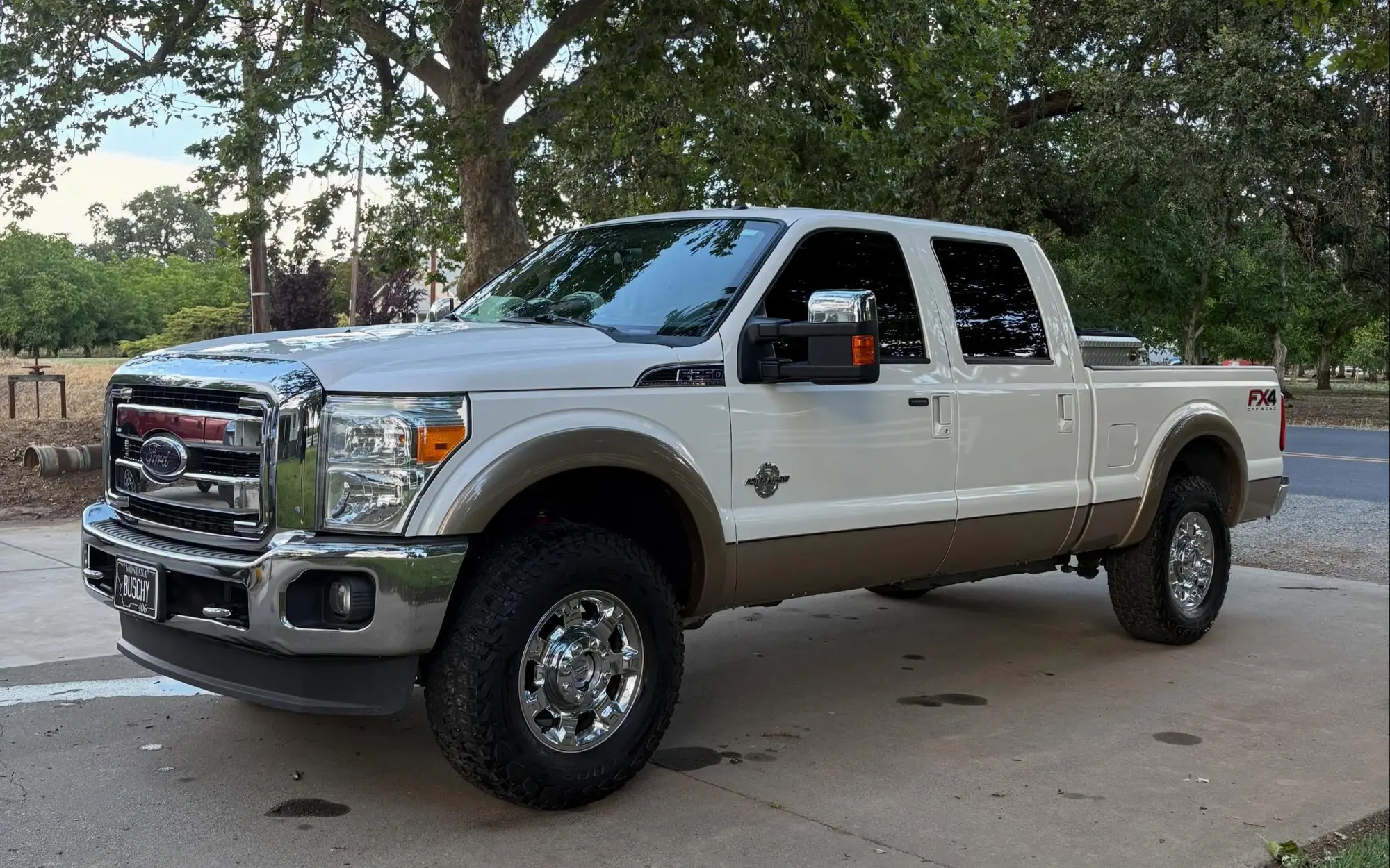 White lifted Ford F-250 kept clean on the Monthly Maintenance plan