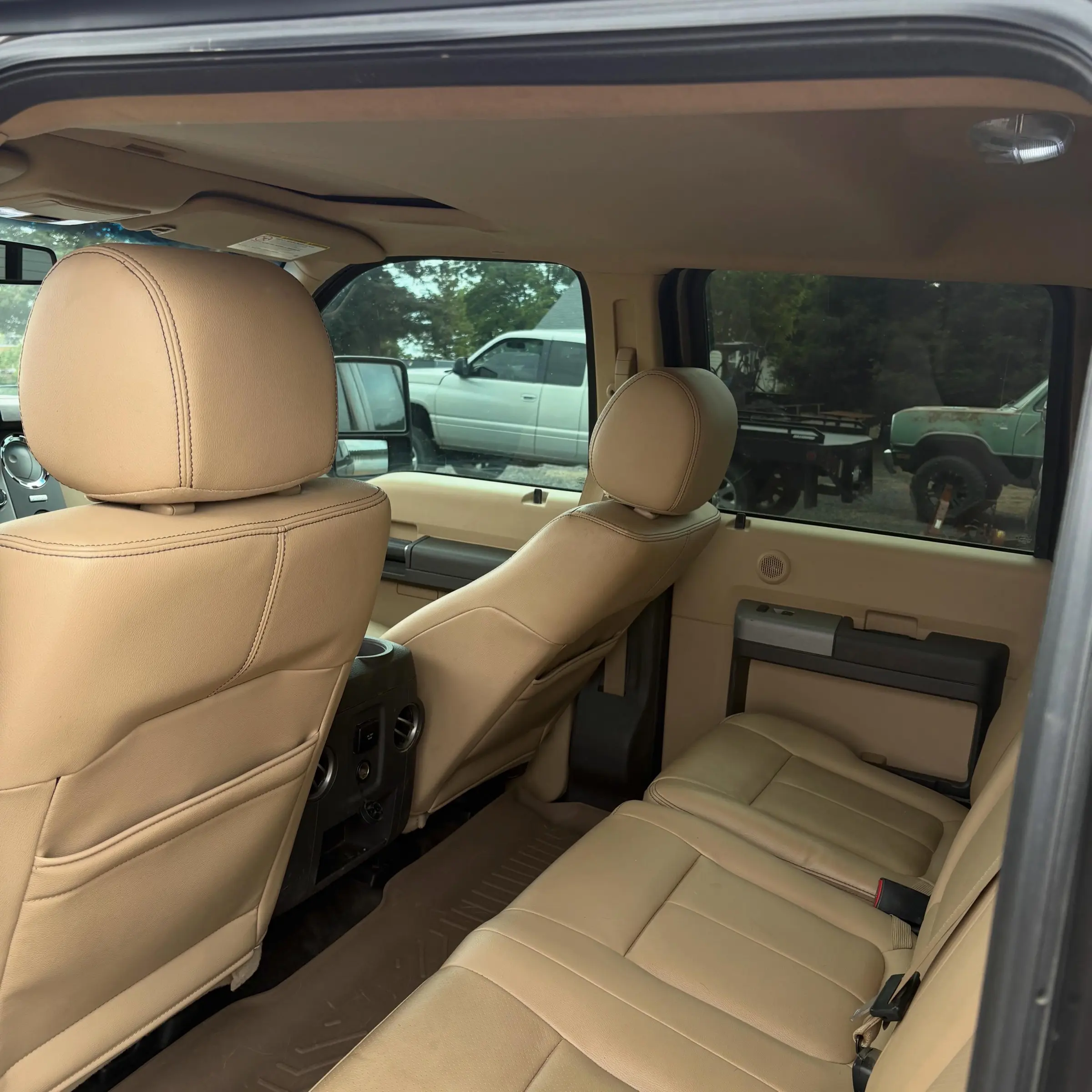 Tan leather rear seats of a Ford F-250 after a Full Detail