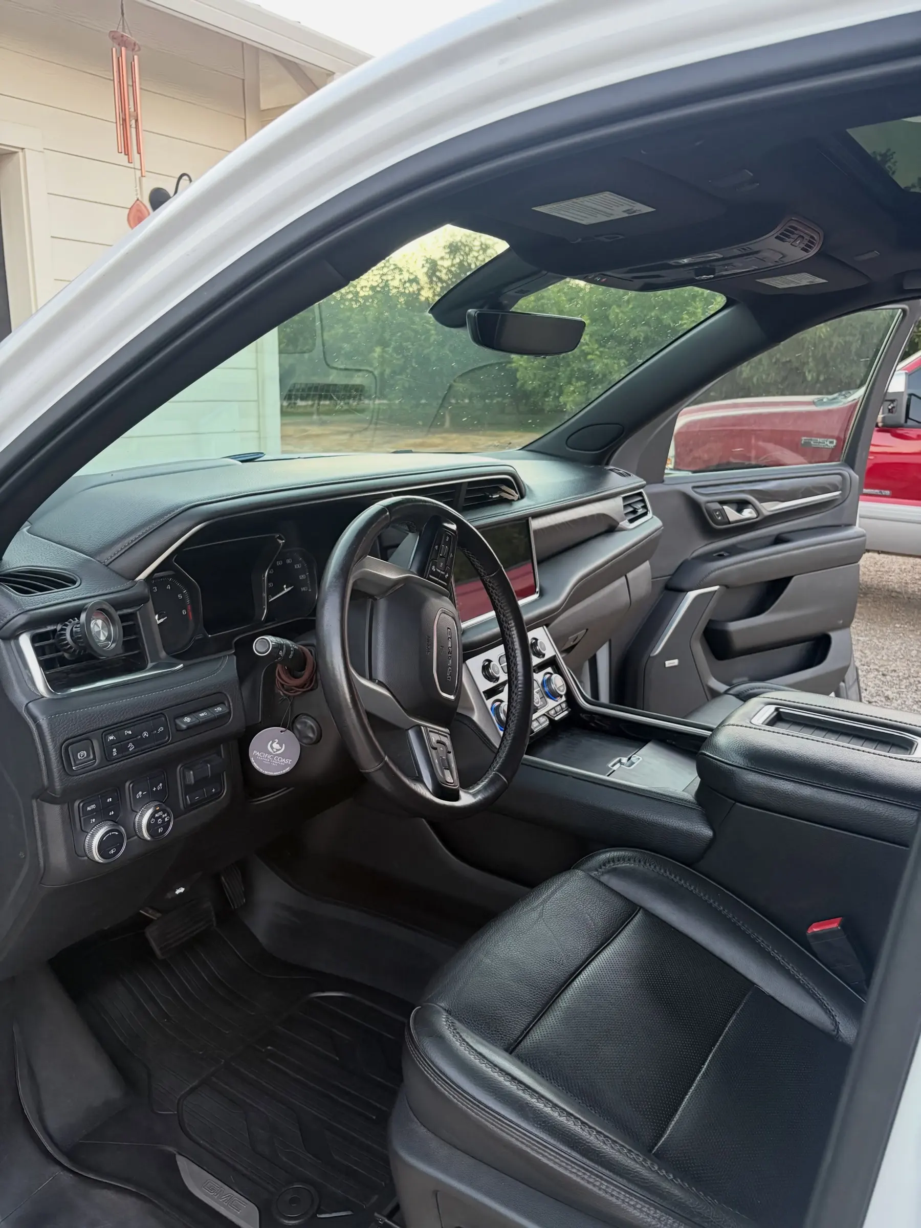 GMC Yukon front seats and steering wheel after a maintenance clean