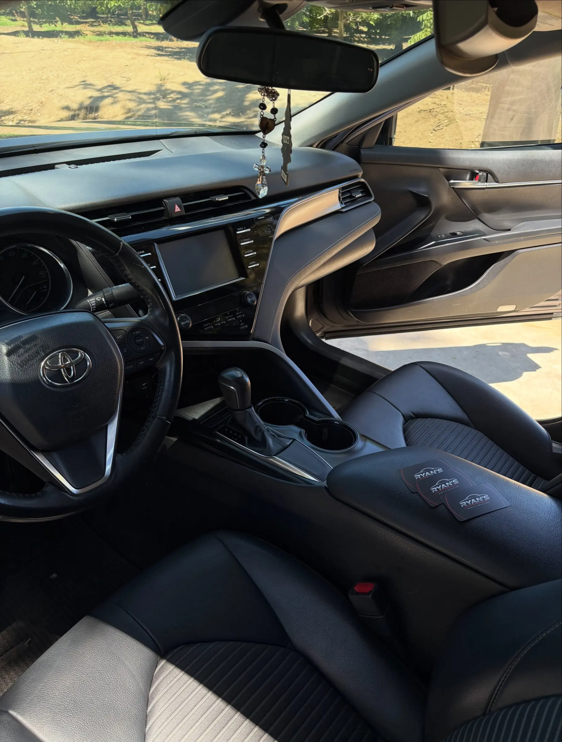 Toyota Camry dashboard and front seats after an interior wipe-down