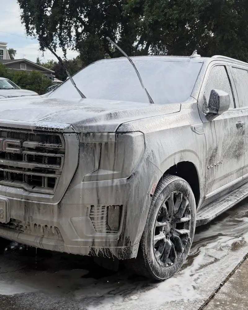 GMC Yukon covered in foam during the wash