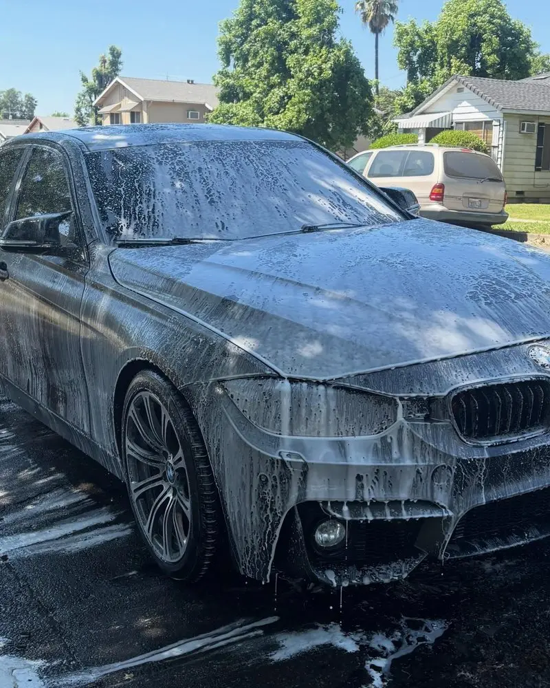 BMW 3 Series covered in foam during the wash