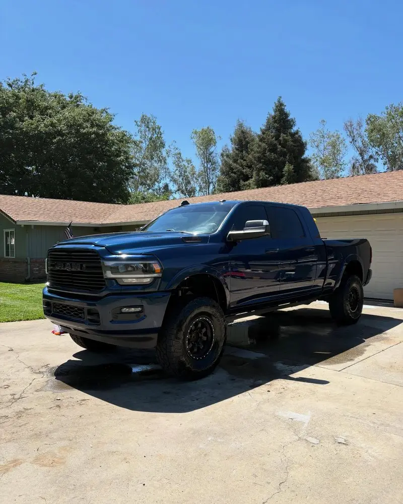 Dark blue Ram 2500 in a driveway after a Full Detail