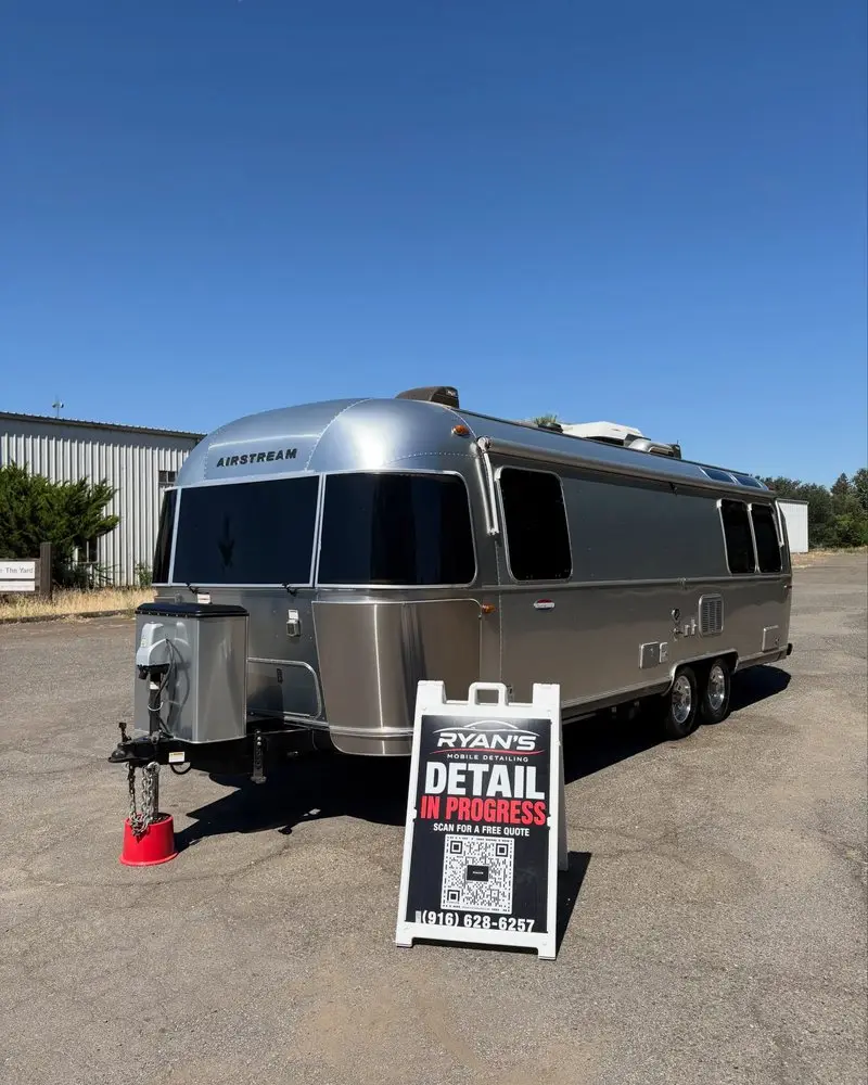 Airstream trailer with the Detail In Progress sign