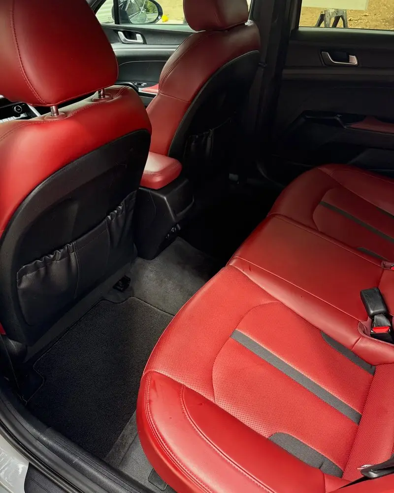 Red leather Kia K5 interior after a Full Detail