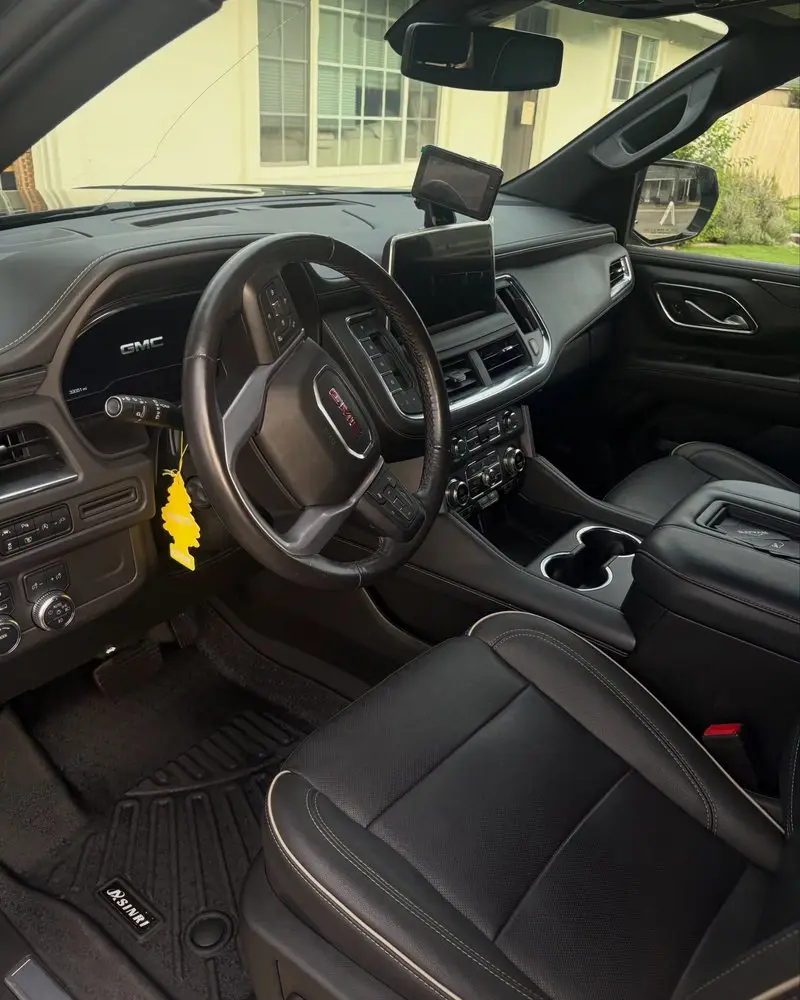 GMC Yukon dashboard and front seats after an interior detail